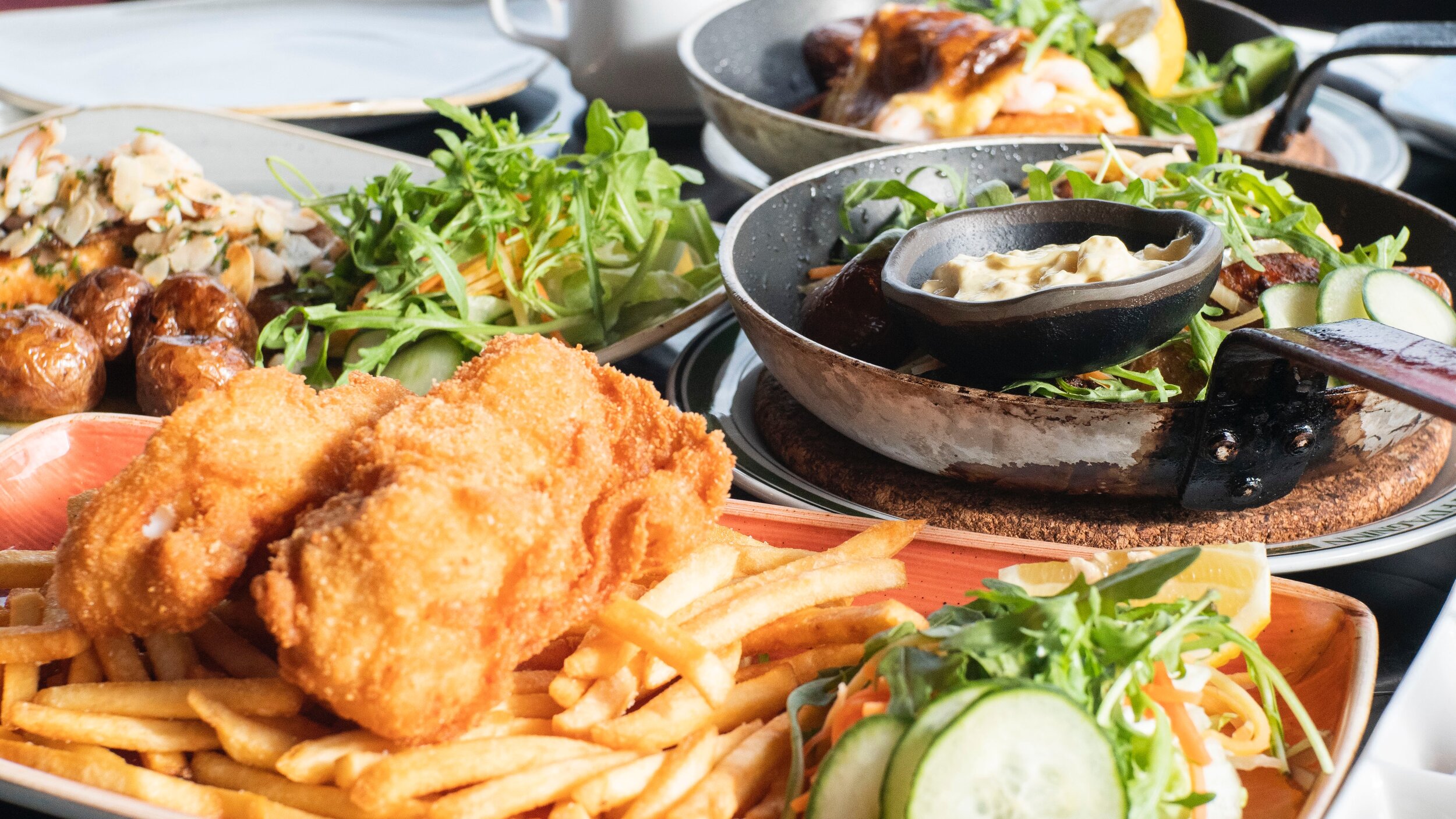 fish and chips next to frying pan